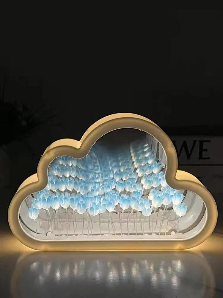 Blue illuminated tulips inside the cloud-shaped mirror