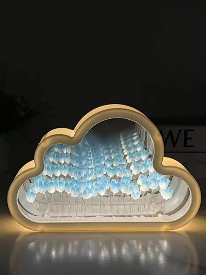 Blue illuminated tulips inside the cloud-shaped mirror