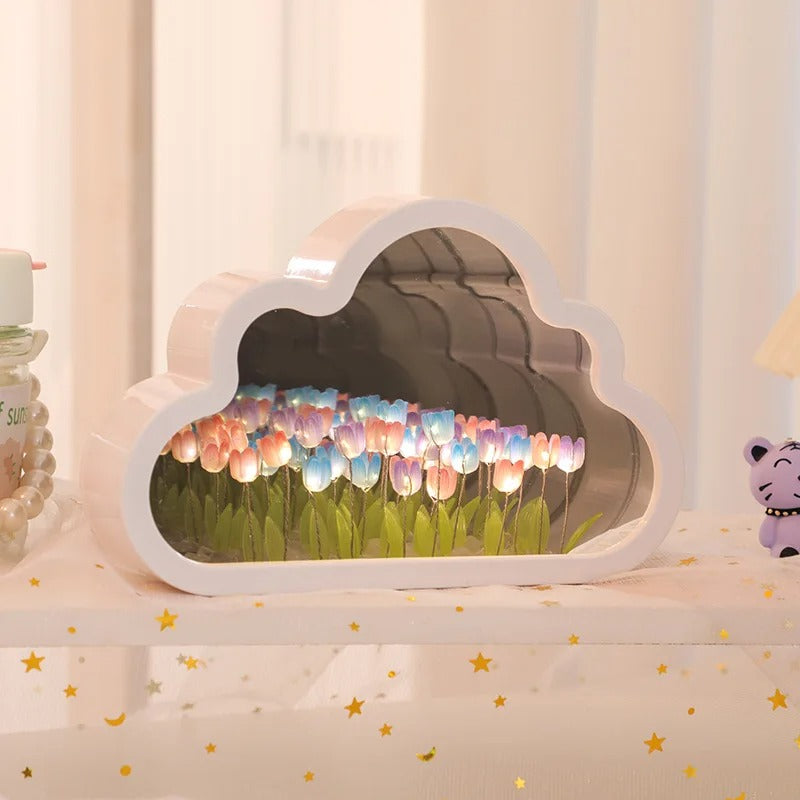 Colourful illuminated tulips inside the cloud-shaped mirror