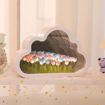 Colourful illuminated tulips inside the cloud-shaped mirror